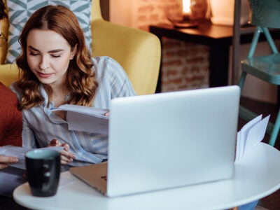 couple sitting on floor working on their finances