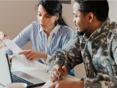 Veteran and his partner reviewing finances.