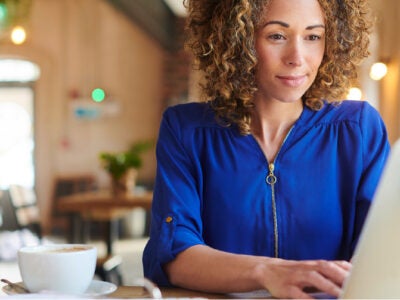 Woman looking up her credit score.