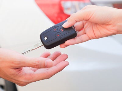 Handing over car keys.