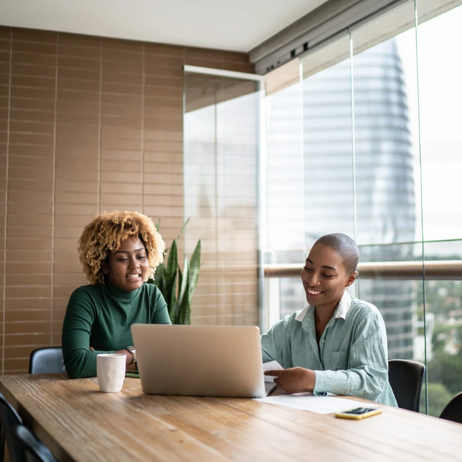 Two women discuss debt management and debt settlement